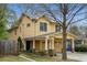Charming two-story home with a covered front porch, well-manicured landscaping, and neutral color palette at 357 Murray Hill Ne Ave, Atlanta, GA 30317