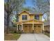 Charming two-story home with a welcoming front porch and well-manicured lawn at 357 Murray Hill Ne Ave, Atlanta, GA 30317