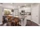Kitchen island with granite countertop, stainless appliances and seating overlooking the dining area at 357 Murray Hill Ne Ave, Atlanta, GA 30317