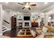 Cozy living room with a fireplace, built-in shelving, hardwood floors, and open layout at 357 Murray Hill Ne Ave, Atlanta, GA 30317