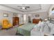 Bright main bedroom featuring tray ceilings, neutral tones, and comfortable furnishings at 357 Murray Hill Ne Ave, Atlanta, GA 30317