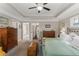 Comfortable main bedroom with neutral tones and an eye to an accessible en-suite bathroom at 357 Murray Hill Ne Ave, Atlanta, GA 30317