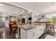 This open concept living area features a kitchen island, dining area, and living room at 357 Murray Hill Ne Ave, Atlanta, GA 30317