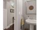 This powder room has a pedestal sink, light gray paint, and a window with a view of the outdoors at 357 Murray Hill Ne Ave, Atlanta, GA 30317
