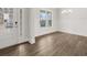 Bright dining room features elegant wainscoting, hardwood floors, and abundant natural light at 7181 Linden Dr, South Fulton, GA 30349