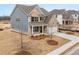 Attractive two-story home with blue siding, a two-car garage, and a well-kept front yard at 7181 Linden Dr, South Fulton, GA 30349