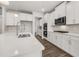 Bright kitchen with white cabinets, stainless steel appliances, tile backsplash, and plenty of counter space at 7181 Linden Dr, South Fulton, GA 30349