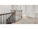 Staircase with a dark wood and black metal railing at 7181 Linden Dr, South Fulton, GA 30349