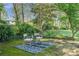 Relaxing backyard with mature trees and outdoor seating area at 2315 Shamrock Dr, Decatur, GA 30032