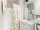 Clean bathroom featuring shower, vanity, mirror, and storage cabinet at 2315 Shamrock Dr, Decatur, GA 30032