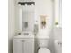 Bathroom featuring updated vanity, mirror, lighting, and toilet at 2315 Shamrock Dr, Decatur, GA 30032