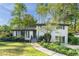 Charming exterior view of home showcasing manicured lawn and a lovely walkway at 2315 Shamrock Dr, Decatur, GA 30032