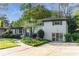 Exterior view of home highlighting landscaped yard and driveway at 2315 Shamrock Dr, Decatur, GA 30032