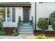 Inviting home entrance featuring elegant front door, updated shutters, and landscaping at 2315 Shamrock Dr, Decatur, GA 30032