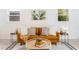 Modern living room boasts a tan sofa, patterned rug, and natural light from windows at 2315 Shamrock Dr, Decatur, GA 30032