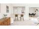 Bright living room featuring breakfast bar with seating and view into dining area at 2315 Shamrock Dr, Decatur, GA 30032