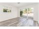 Bright living room features wood floors, large windows with backyard view, and sliding glass doors at 2315 Shamrock Dr, Decatur, GA 30032