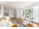 Bright living room with hardwood floors and large windows offering plenty of natural light at 2315 Shamrock Dr, Decatur, GA 30032
