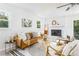 Cozy living room features a fireplace, soft carpet, and comfortable seating at 2315 Shamrock Dr, Decatur, GA 30032