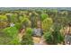Beautiful home surrounded by mature trees, providing privacy and a serene setting at 3997 Ironhill Ln, Woodstock, GA 30189