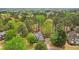 Aerial shot showcasing a lovely home with a spacious yard and verdant surroundings at 3997 Ironhill Ln, Woodstock, GA 30189
