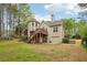 The backyard showcases a wooden deck and a unique turret-style extension at 3997 Ironhill Ln, Woodstock, GA 30189