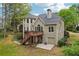 Rear view features a backyard deck and patio perfect for outdoor entertaining at 3997 Ironhill Ln, Woodstock, GA 30189