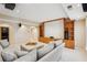 Comfortable basement living area features a media center with built in shelving, neutral walls and carpet at 3997 Ironhill Ln, Woodstock, GA 30189