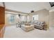 Open basement showcasing large sectional, recessed lights, and a ceiling-mounted projector at 3997 Ironhill Ln, Woodstock, GA 30189