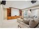 Finished basement featuring a home theater setup with built-in shelving, large screen, and comfortable seating at 3997 Ironhill Ln, Woodstock, GA 30189
