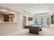 Basement featuring a pool table with bay window and a built in bar at 3997 Ironhill Ln, Woodstock, GA 30189