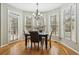Breakfast nook bathed in natural light featuring hardwood floors, neutral walls, and modern lighting at 3997 Ironhill Ln, Woodstock, GA 30189