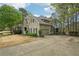 Attractive home featuring an attached garage and long driveway and lush, green lawn at 3997 Ironhill Ln, Woodstock, GA 30189
