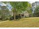 Charming two-story home featuring a welcoming front porch and beautifully landscaped yard at 3997 Ironhill Ln, Woodstock, GA 30189