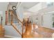 Spacious entryway with hardwood floors, staircase, and natural light at 3997 Ironhill Ln, Woodstock, GA 30189