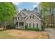 Charming home with landscaped yard, covered porch, and manicured shrubbery at 3997 Ironhill Ln, Woodstock, GA 30189