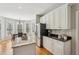 Modern kitchen with white cabinets, stainless steel appliances, and granite countertops at 3997 Ironhill Ln, Woodstock, GA 30189