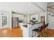 Well-lit kitchen boasts stainless steel appliances, granite countertops, island, and a breakfast bar at 3997 Ironhill Ln, Woodstock, GA 30189