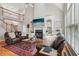 Inviting living room featuring vaulted ceiling, fireplace, built-ins, and comfortable leather seating at 3997 Ironhill Ln, Woodstock, GA 30189