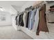 Spacious walk-in closet features ample shelving and storage for an organized wardrobe at 3997 Ironhill Ln, Woodstock, GA 30189