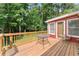 Wooden deck with a table and chair, offering a peaceful outdoor retreat at 5666 Bob White Nw Cir, Lilburn, GA 30047