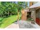 Spacious backyard with a patio and stairs leading to an upper deck at 5666 Bob White Nw Cir, Lilburn, GA 30047