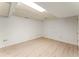 Unfurnished basement area with light wood-look flooring and neutral walls at 5666 Bob White Nw Cir, Lilburn, GA 30047