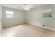Cozy bedroom with bright natural light through two large windows and clean flooring at 5666 Bob White Nw Cir, Lilburn, GA 30047