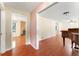 View of living room, showcasing hardwood floors, and doorway to the room with the fireplace at 5666 Bob White Nw Cir, Lilburn, GA 30047