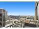 Enjoy city views from this condo balcony with comfortable seating and a metal railing at 855 Peachtree Ne St # 3005, Atlanta, GA 30308