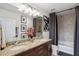 Bathroom featuring double sinks, granite countertops, and a shower-tub combination at 855 Peachtree Ne St # 3005, Atlanta, GA 30308