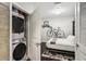 Spare bedroom features a washer and dryer, and bike hanging on the wall at 855 Peachtree Ne St # 3005, Atlanta, GA 30308