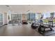Modern gym with exercise equipment and large windows at 855 Peachtree Ne St # 3005, Atlanta, GA 30308