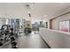 Bright gym with city views and various workout equipment at 855 Peachtree Ne St # 3005, Atlanta, GA 30308